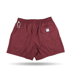 The Fedeli Wine Red Microfiber Madeira Swim Shorts are men's luxury casual wear.