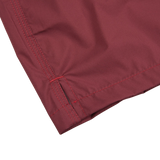 The back of a Fedeli Wine Red Microfiber Madeira Swim Shorts with wine red stitching.