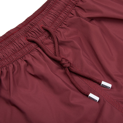 A close up of Fedeli Wine Red Microfiber Madeira Swim Shorts.