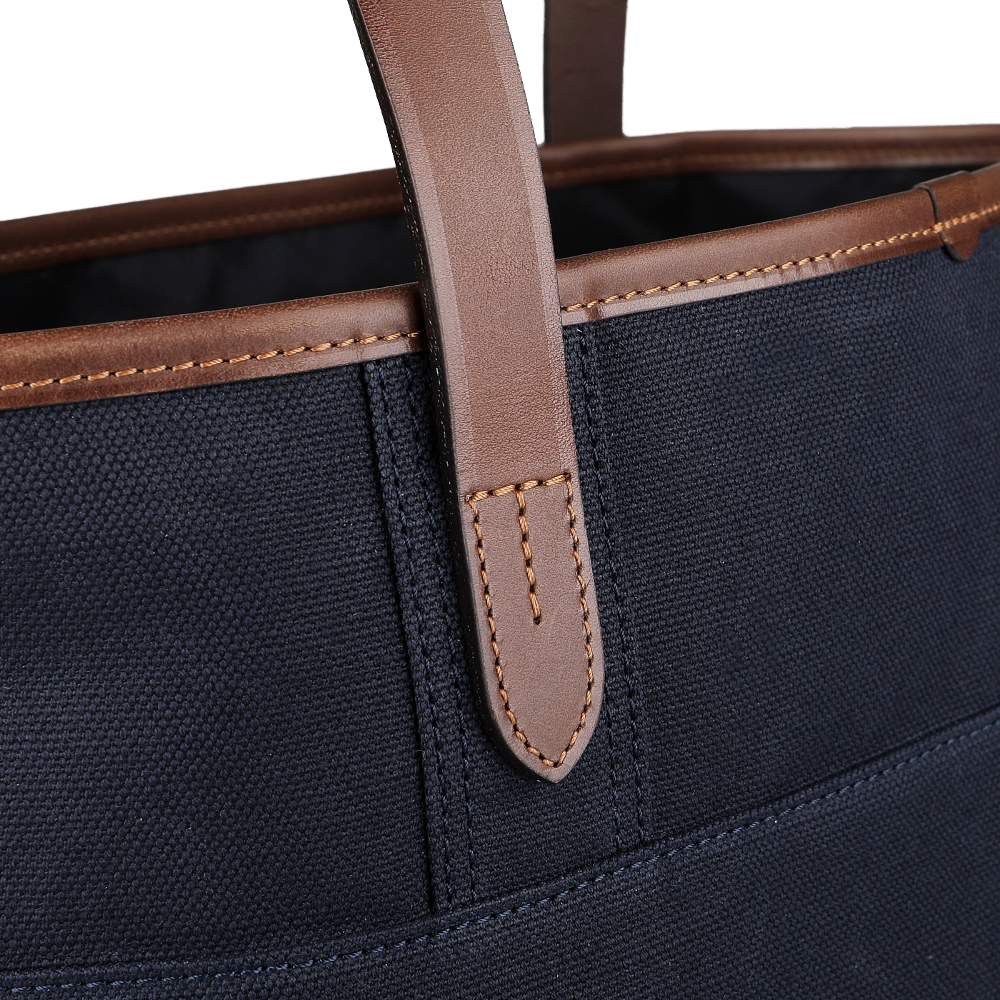 Close-up of the Felisi Navy Blue Cotton Canvas Leather Tote Bag, showcasing its rich vacchetta calf leather handles and stitching details.