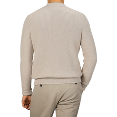 A person is depicted from the back wearing a Filippo de Laurentiis Beige Melange Wool Cashmere Cardigan paired with light gray pants.