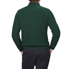 A person is shown from the back, wearing a Filippo de Laurentiis Bottle Green Cashmere Rib Knit Cardigan featuring a two-way zip closure, paired with dark pants.