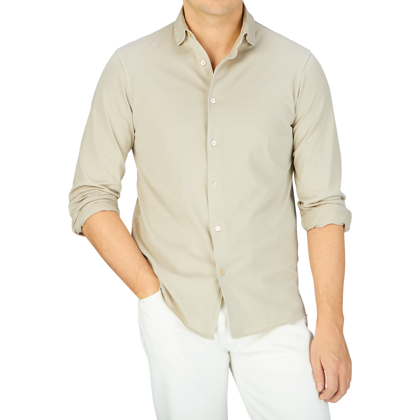 A man wearing a Filippo de Laurentiis Ciottollo Beige Cotton Jersey Knitted Shirt and white pants.
