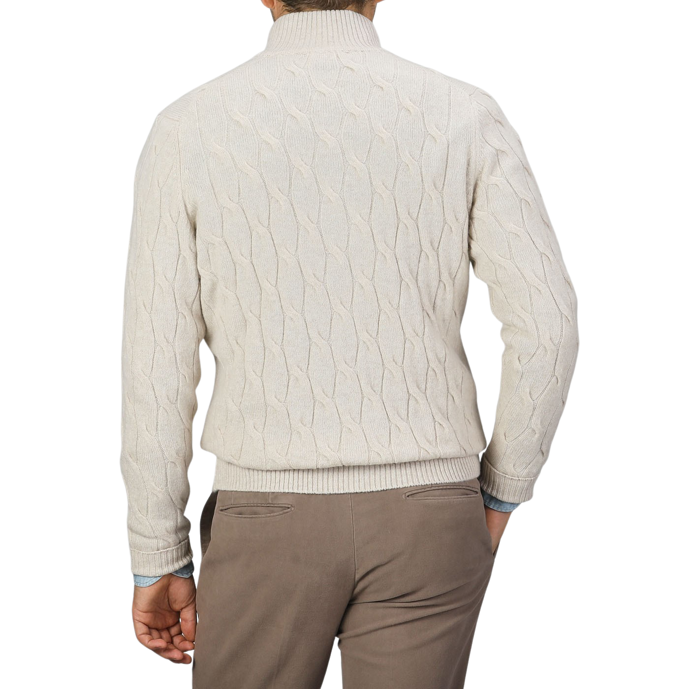 A person stands facing away from the camera, wearing a Filippo de Laurentiis Cream Wool Cashmere Cableknit Button Cardigan, paired with brown pants.