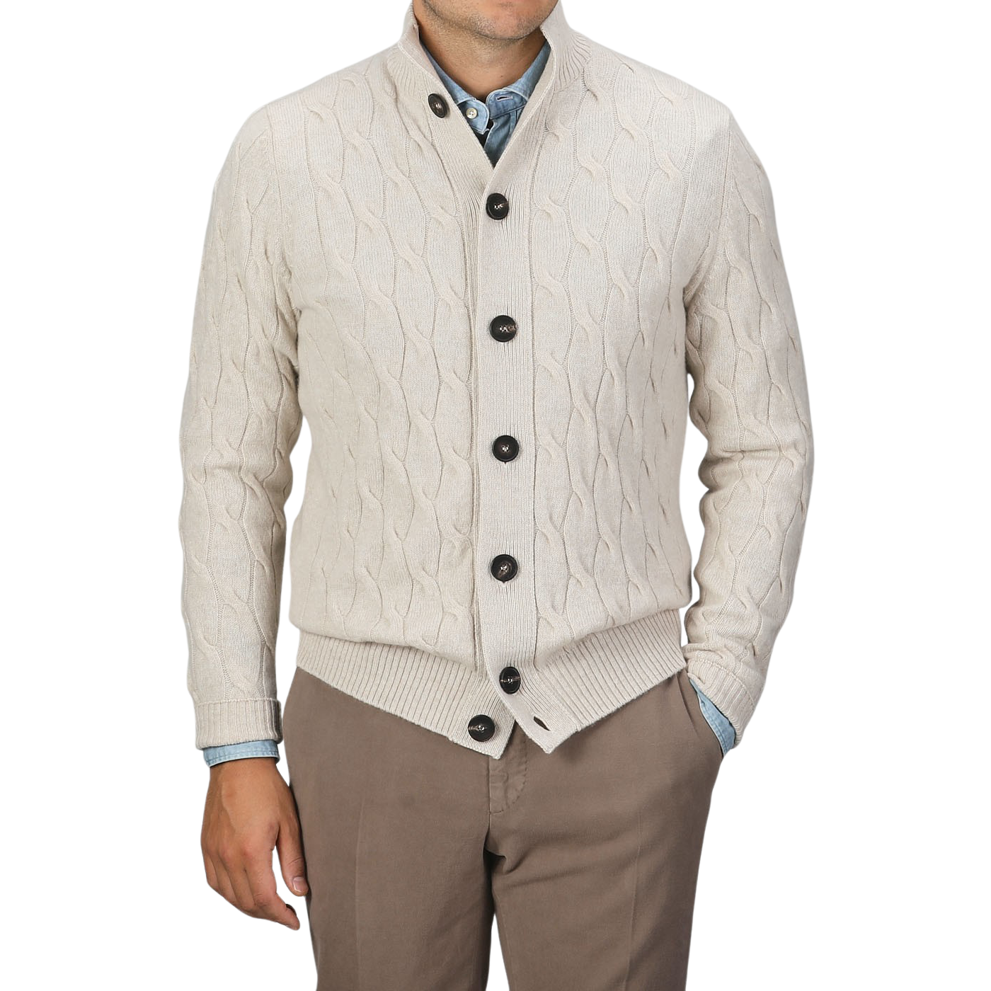 A person is wearing a Filippo de Laurentiis Cream Wool Cashmere Cableknit Button Cardigan over a blue shirt, paired with brown pants, standing against a plain background.