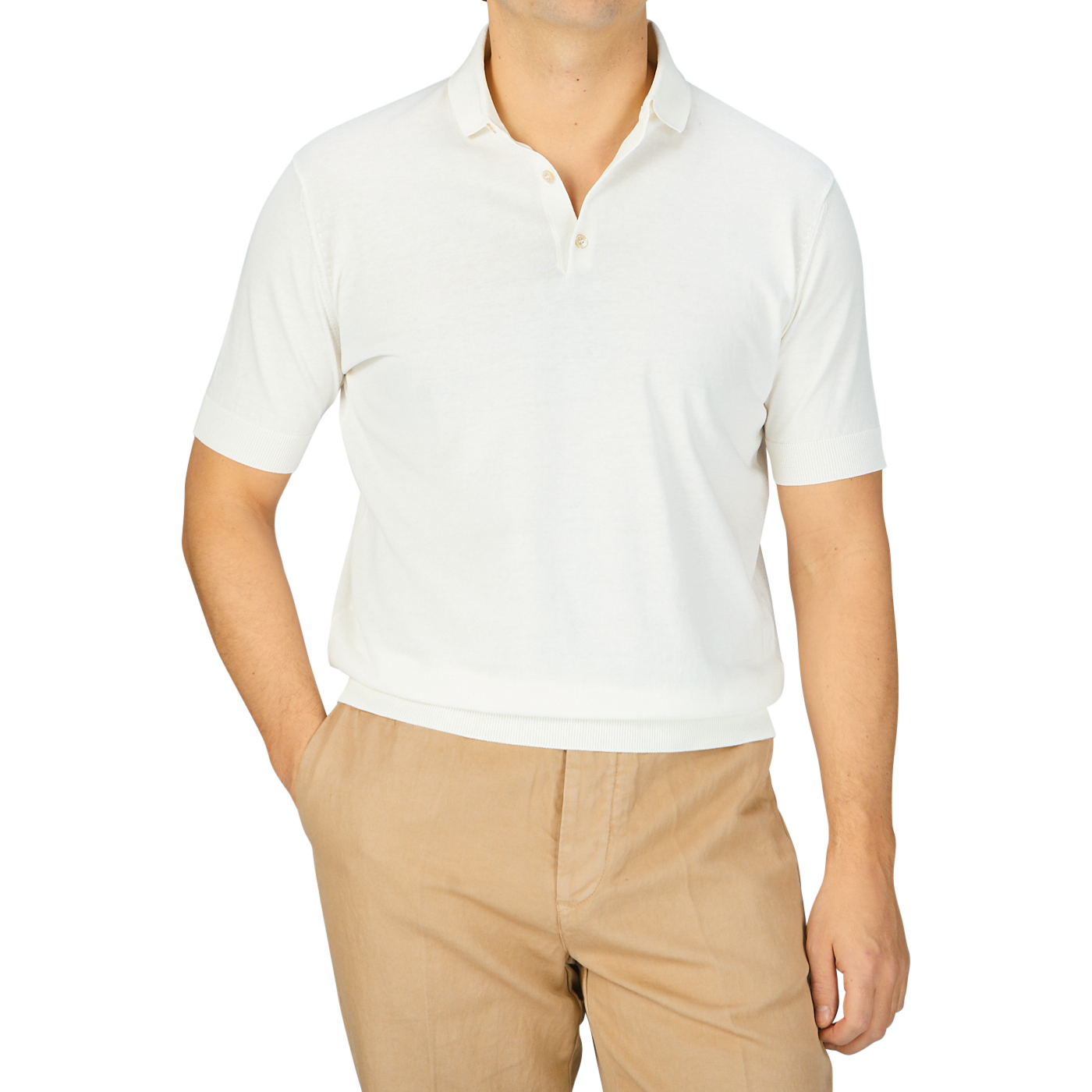 A man wearing a Latte White Crepe Cotton Polo Shirt by Filippo de Laurentiis and tan pants.