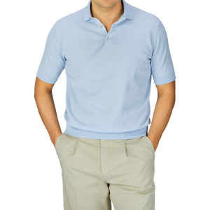 A man wearing a Light Blue Crepe Cotton Filippo de Laurentiis polo shirt and beige pants.
