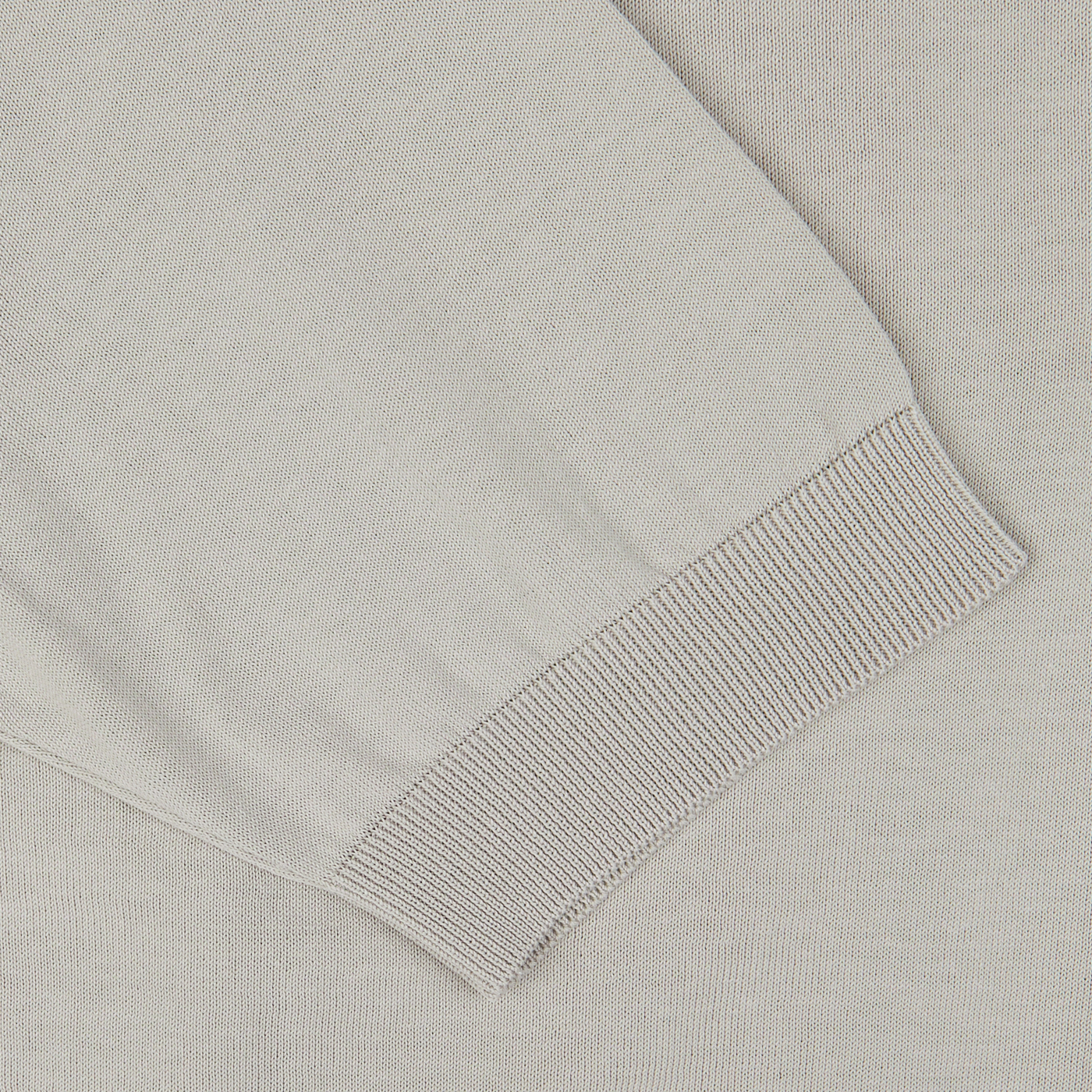 Close-up of a Nebbia Grey Crepe Cotton Polo Shirt with a ribbed cuff detail, made in Italy by Filippo de Laurentiis.