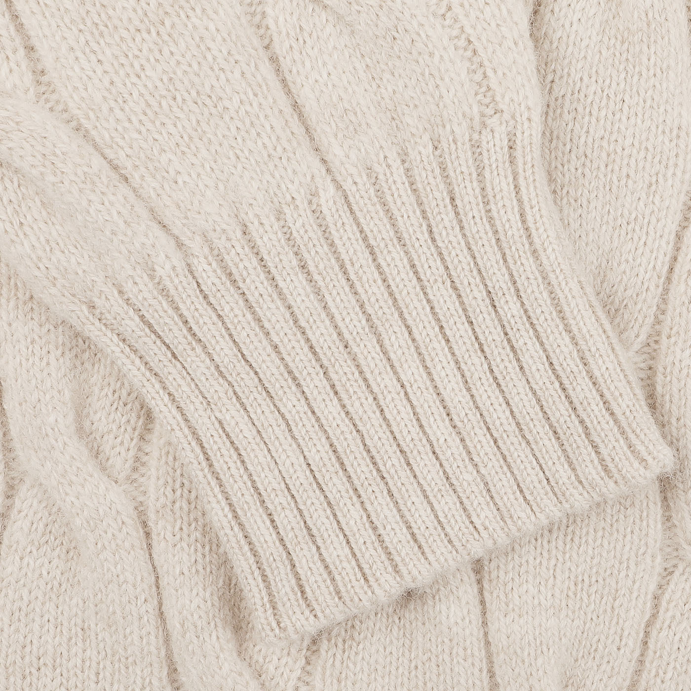 Close-up of the Filippo de Laurentiis Cream Wool Cashmere Cableknit Button Cardigan featuring a ribbed cuff and button closure.