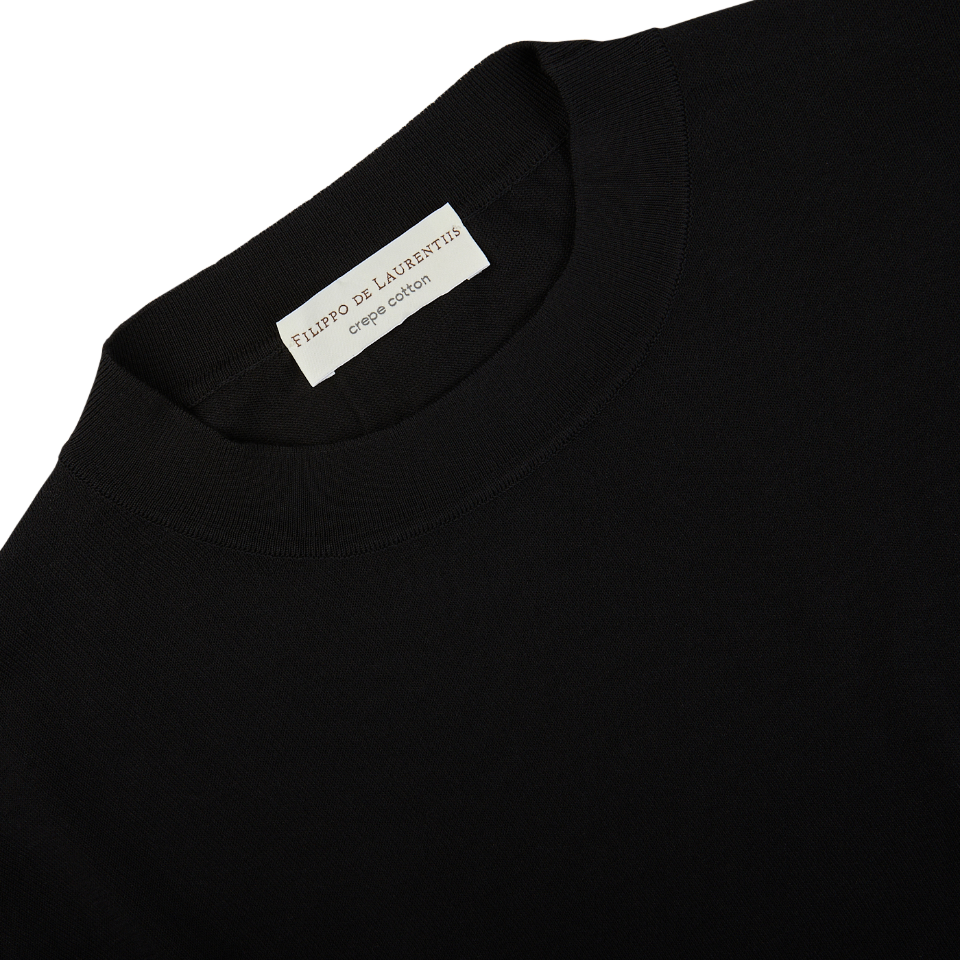 A black crepe cotton oversized t-shirt with a white label by Filippo de Laurentiis.