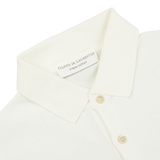 A close up of a white Filippo de Laurentiis Latte White Crepe Cotton Polo Shirt.