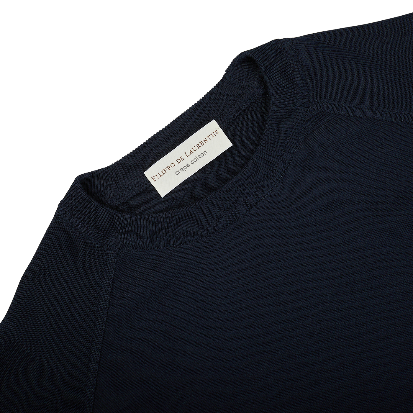 The back of a Filippo de Laurentiis navy blue crepe cotton crew neck sweater with a label on it.