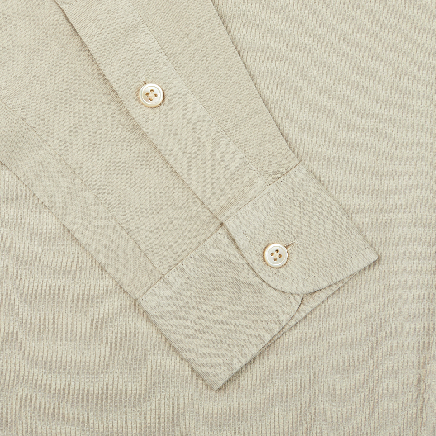 A close up of a Filippo de Laurentiis Ciottollo Beige Cotton Jersey Knitted Shirt with buttons.