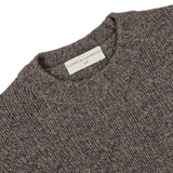 A close-up of the Brown Melange Yak Cashmere Sweater's neckline and label, which reads "Filippo de Laurentiis," showcasing the luxurious blend of yak wool and cashmere—a true seasonal staple.