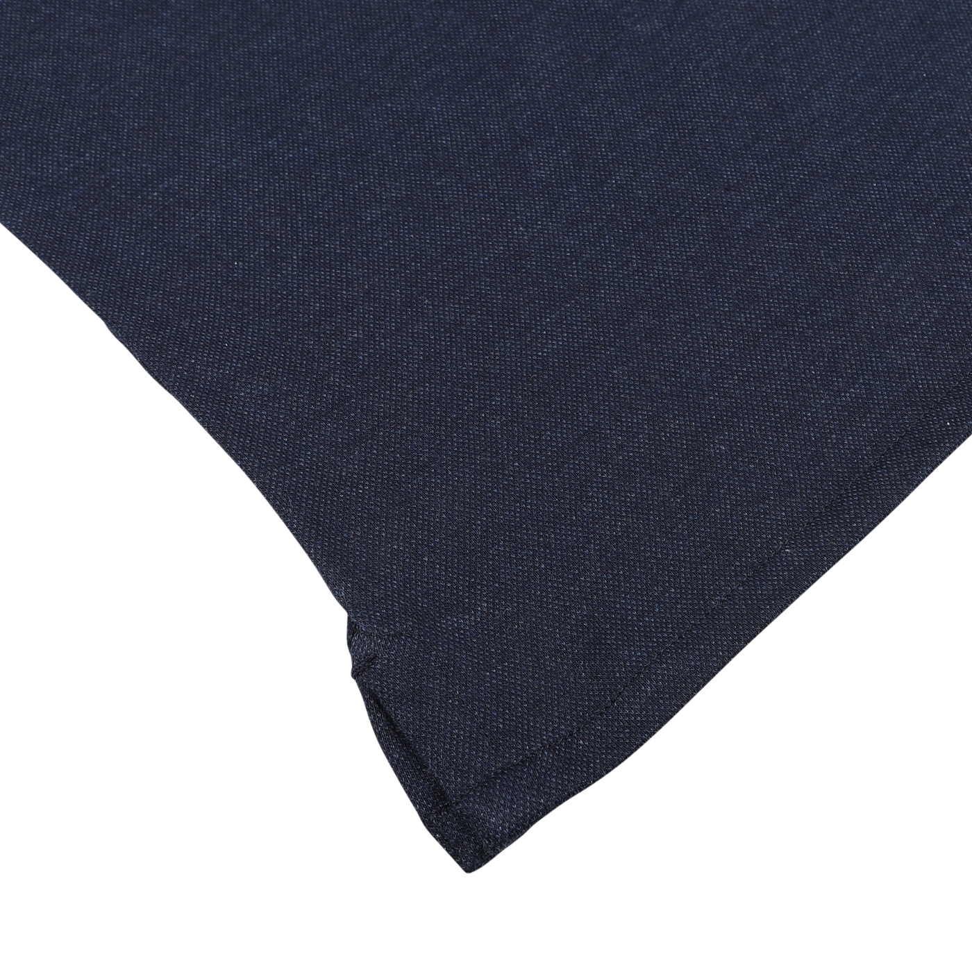 Close-up of the corner of a Blue Melange Cotton Cashmere Jersey Polo Shirt from Finamore, folded over a white surface.