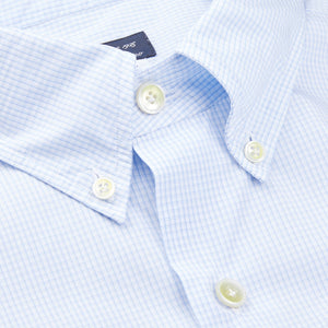 A close up of a Finamore Light Blue Cotton Small Check BD Shirt with white buttons.