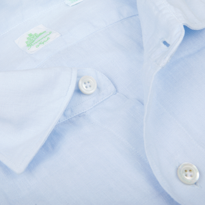 Close-up of a Finamore light blue, pure linen casual shirt with a collar and buttons.