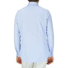 A man wears a Light Blue Washed Cotton Twill shirt by Finamore.