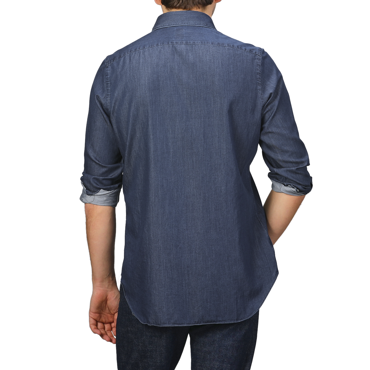 A person with rolled-up sleeves is shown from the back, effortlessly sporting a Medium Blue Cotton Denim Casual Shirt by Finamore and jeans.