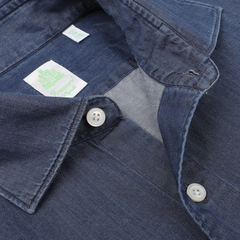 Close-up of an open collar of the Medium Blue Cotton Denim Casual Shirt with white buttons, featuring visible brand tags from Finamore inside, showcasing its handcrafted precision.