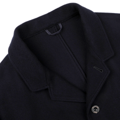 Close-up of the Navy Blue Boiled Wool Casual Blazer by Finamore, featuring a fastened top button and inner loop for hanging, highlighting the collar design.