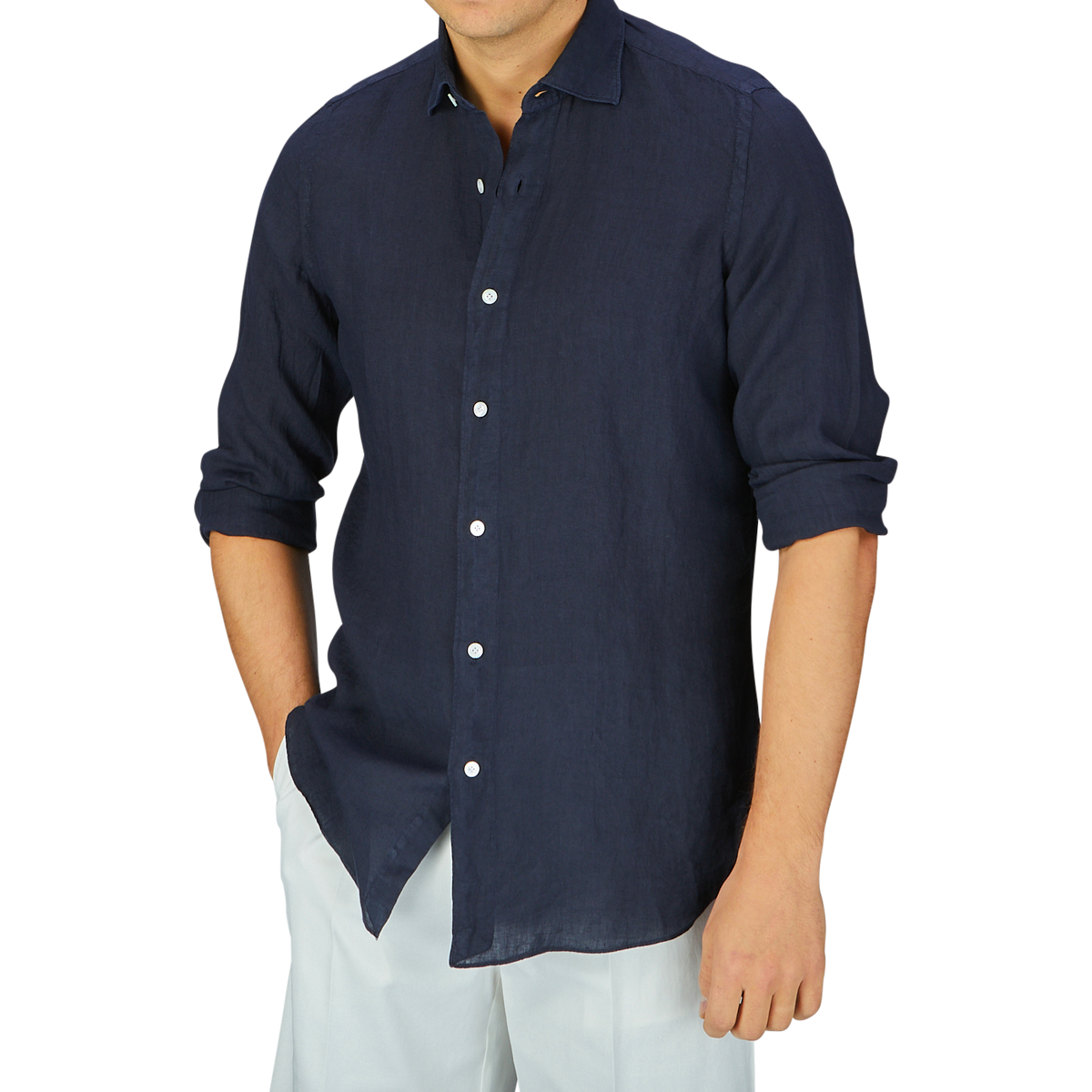 A person wearing a Finamore Navy Blue Linen Casual Shirt and white pants against a gray background.