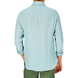A man from behind wearing a light blue slim fit shirt and Finamore sage Green Linen Casual Shirt.