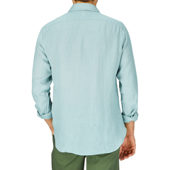 A man from behind wearing a light blue slim fit shirt and Finamore sage Green Linen Casual Shirt.