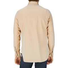 A man in a Sand Beige Washed Cotton Twill shirt, likely a Finamore handmade shirt, seen from behind.