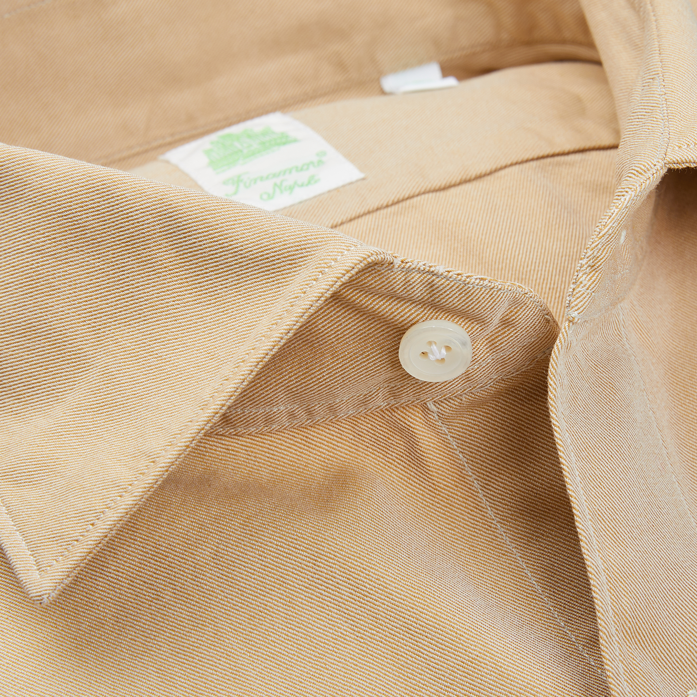 A close up of a Finamore Sand Beige Washed Cotton Twill Shirt from Naples.