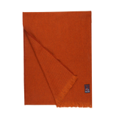 A Burnt Sienna Merino Wool Cashmere Scarf made by Fox Brothers, with fringes on a white background.