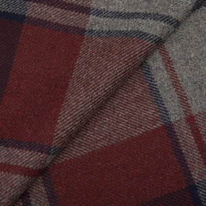 A close up of a Wine Fox Check Merino Wool Cashmere Scarf by Fox Brothers in a red and grey plaid fabric.