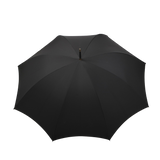 The Black Fox Head Handle Umbrella by Fox Umbrellas is open, displayed on a white background. This large black handmade umbrella features a wooden fox head handle and an eight-rib metal frame for enhanced durability and elegance.