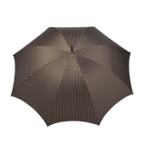 A top view of a fully opened Fox Umbrellas' "Green Red Striped Maple Handle Umbrella," showcasing its handmade design with thin, vertical, multi-colored stripes against a dark background and complemented by a polished dark maple handle.