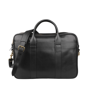 The Frank Clegg Black Tumbled Leather Commuter Briefcase, designed to fit a 15" laptop, is showcased against a plain background. It boasts two sturdy handles and an adjustable shoulder strap for versatile carrying.