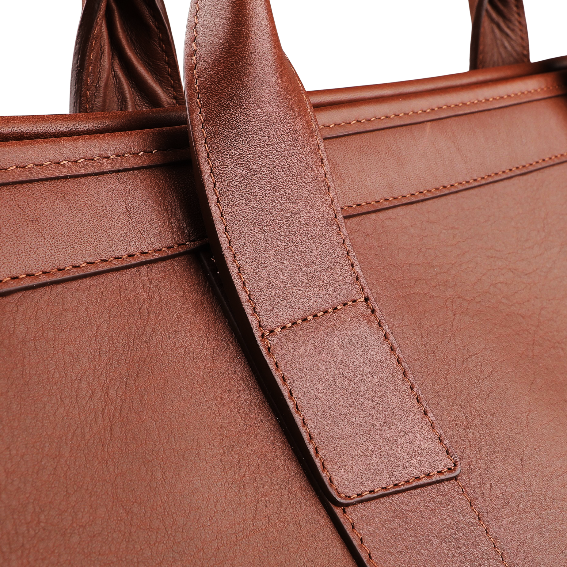 Close-up of the Frank Clegg Chestnut Tumbled Leather Signature Travel Duffle, highlighting its textured surface and the hand-crafted quality seen in the handle's stitching.