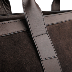 Close-up of the Frank Clegg Chocolate Suede Leather Tall Zip Tote, highlighting its detailed stitching and elegant texture for a timeless style.