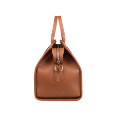 Side view of Frank Clegg's Cognac Harness Leather Small Travel Duffle, featuring handles and a top zipper closure, perfect as a stylish weekend bag.