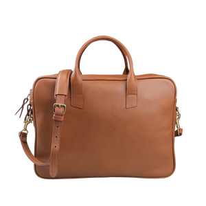 The Cognac Tumbled Leather Computer Briefcase by Frank Clegg is crafted from tumbled calf leather, featuring sturdy handles and an adjustable shoulder strap, perfectly fitting a 15" laptop.