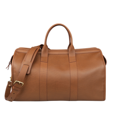 The Cognac Tumbled Leather Signature Duffle by Frank Clegg, a luxurious handcrafted brown leather bag with a shoulder strap and two handles, rests on a plain background.