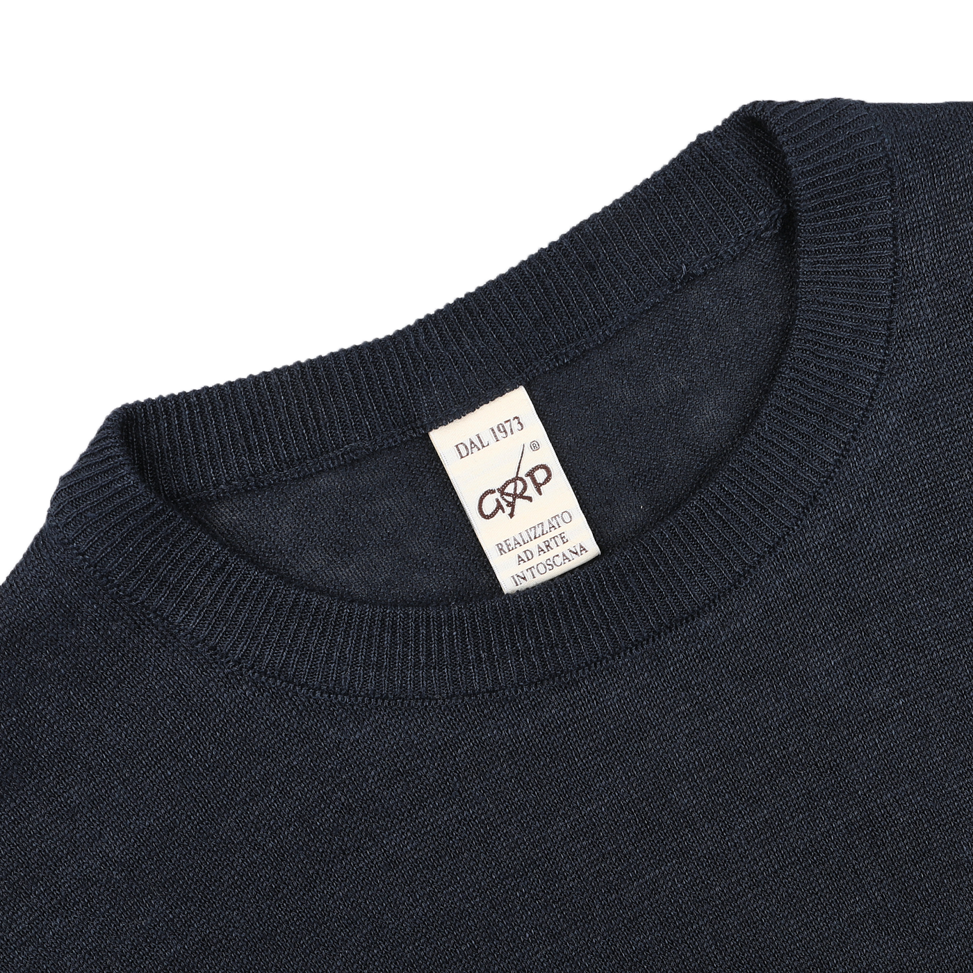 The G.R.P Dark Blue Linen Crewneck Sweater features a beige collar label reading "DAL 1973, Realizzato A Mano, In Toscana." Made from pure linen, it offers breathable comfort.