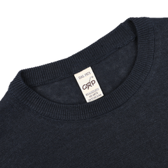 The G.R.P Dark Blue Linen Crewneck Sweater features a beige collar label reading "DAL 1973, Realizzato A Mano, In Toscana." Made from pure linen, it offers breathable comfort.