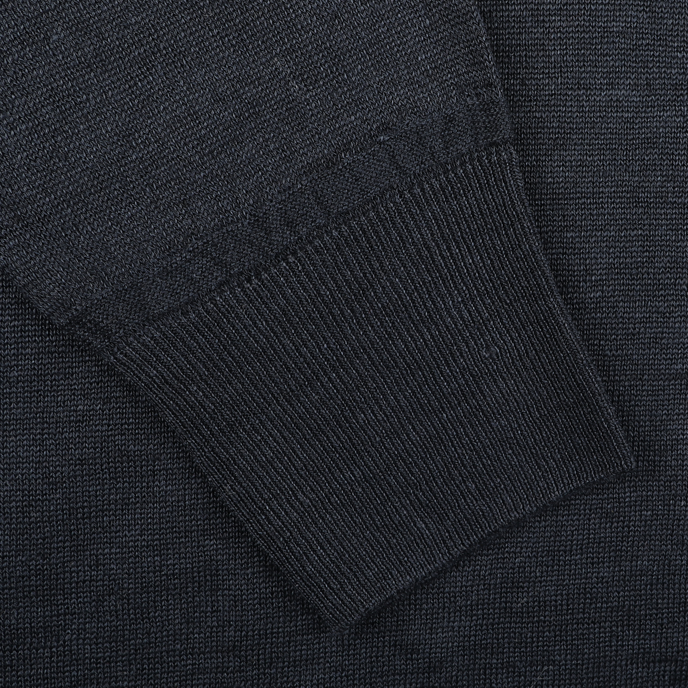 Close-up of a G.R.P Dark Blue Linen Crewneck Sweater sleeve, highlighting the cuff and detailed knit texture.