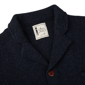 A regular fit G.R.P blue Melange Merino Wool Knitted Jacket with a label on the back.