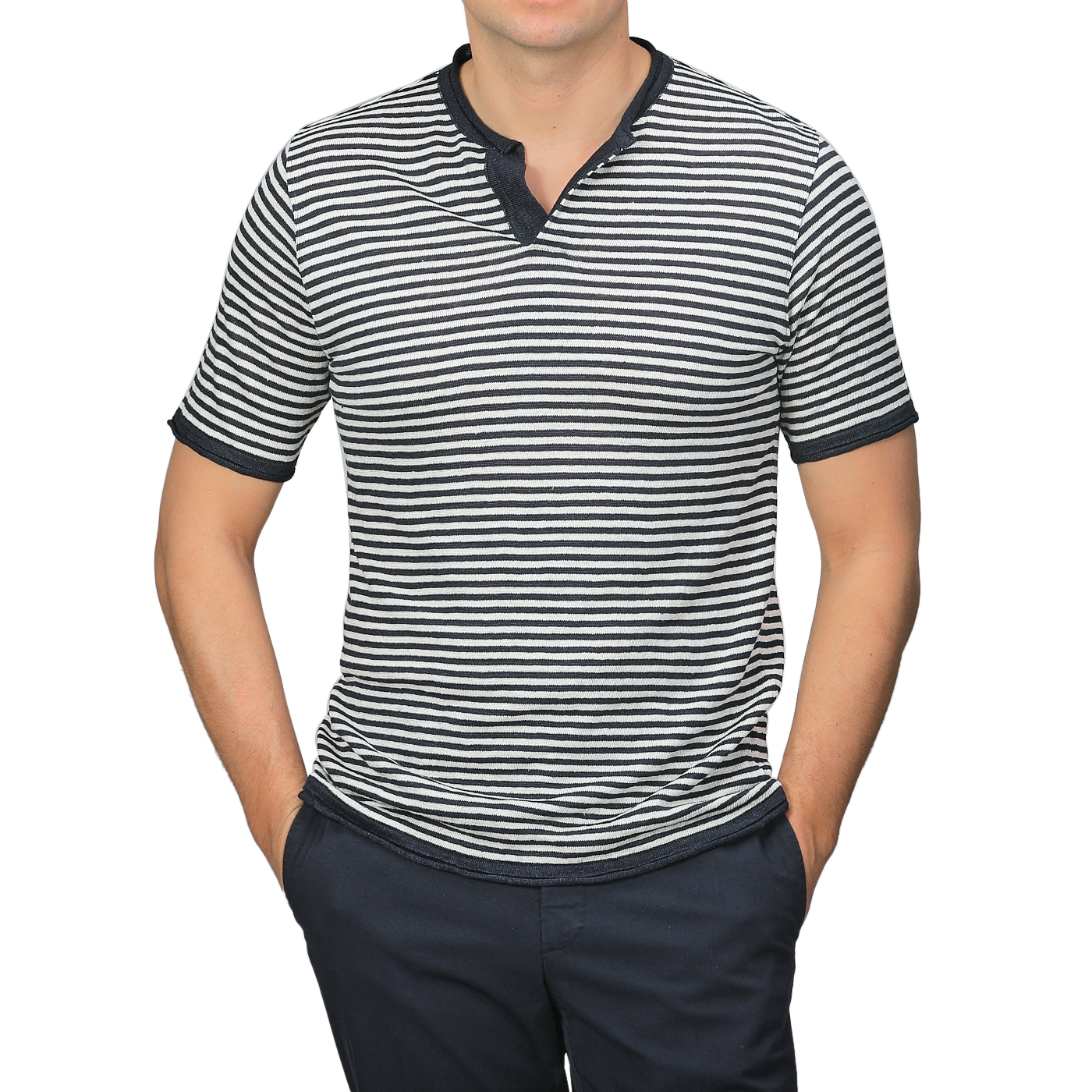 A person stands confidently against a plain background wearing a G.R.P Blue Ecru Striped Linen Henley T-Shirt, featuring a slim fit and dark collar, paired with dark pants.