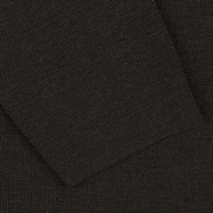 Close-up view of the Brown Melange Wool Crewneck Sweater by G.R.P., showcasing a dark brown melange knit fabric with a rectangular piece layered on top, reminiscent of the texture found in a seasonal crewneck sweater.