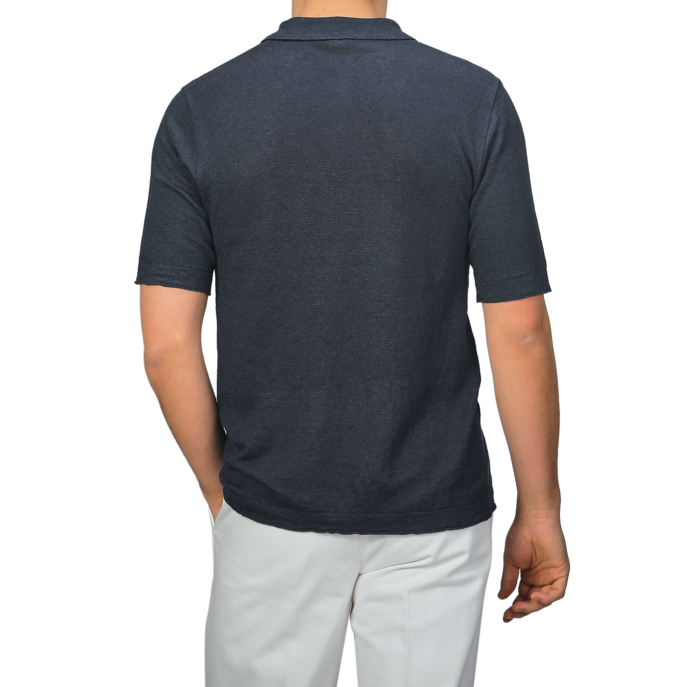 Back view of a person wearing a G.R.P Dark Blue Linen Polo Shirt paired with white pants.