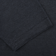 Close-up of a dark gray textured fabric with visible seam, showing intersecting threads, reminiscent of the fine craftsmanship seen in G.R.P's Dark Blue Linen Polo Shirt.