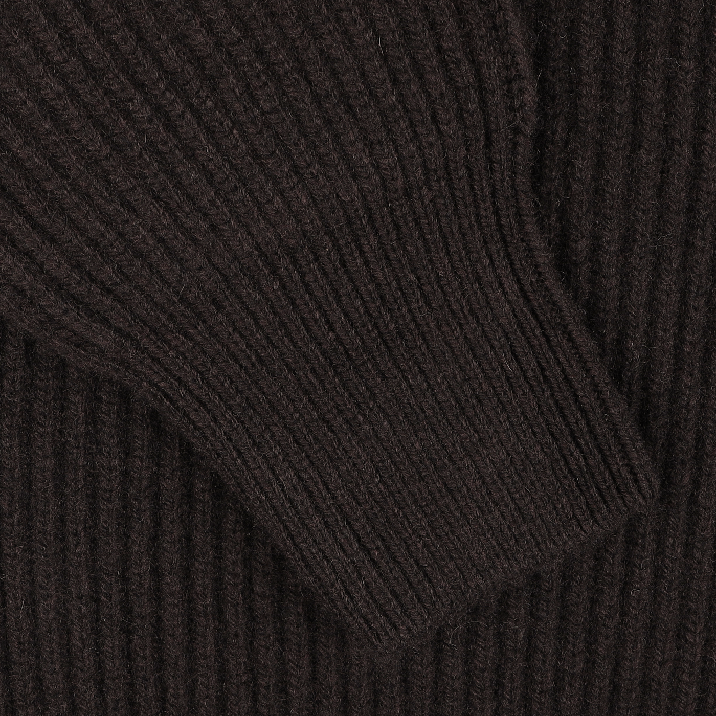 A close-up of the G.R.P Dark Brown Wool Cashmere Zip Jacket highlights its ribbed knit fabric, with a focus on a folded or seamed section that suggests a sleeve or similar garment detail.