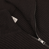 Close-up of the Dark Brown Wool Cashmere Zip Jacket by G.R.P, featuring ribbed wool cashmere fabric and a partially opened silver zipper that reveals the care and brand details tag.